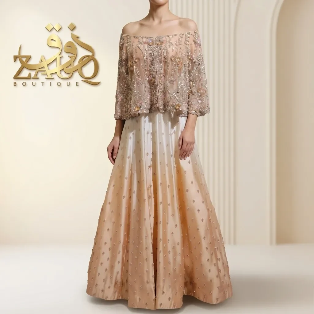 A champagne embroidered cape over a soft lehanga.