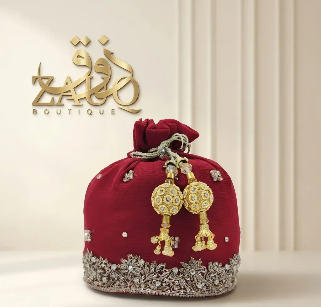 Crimson velvet with a worked base and gold tassels.