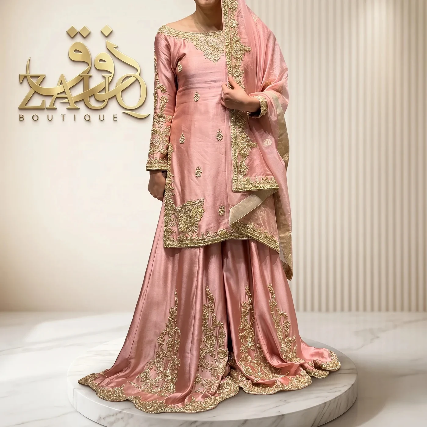 Pink silk flared in one continuous line from the waist, with a gold border.