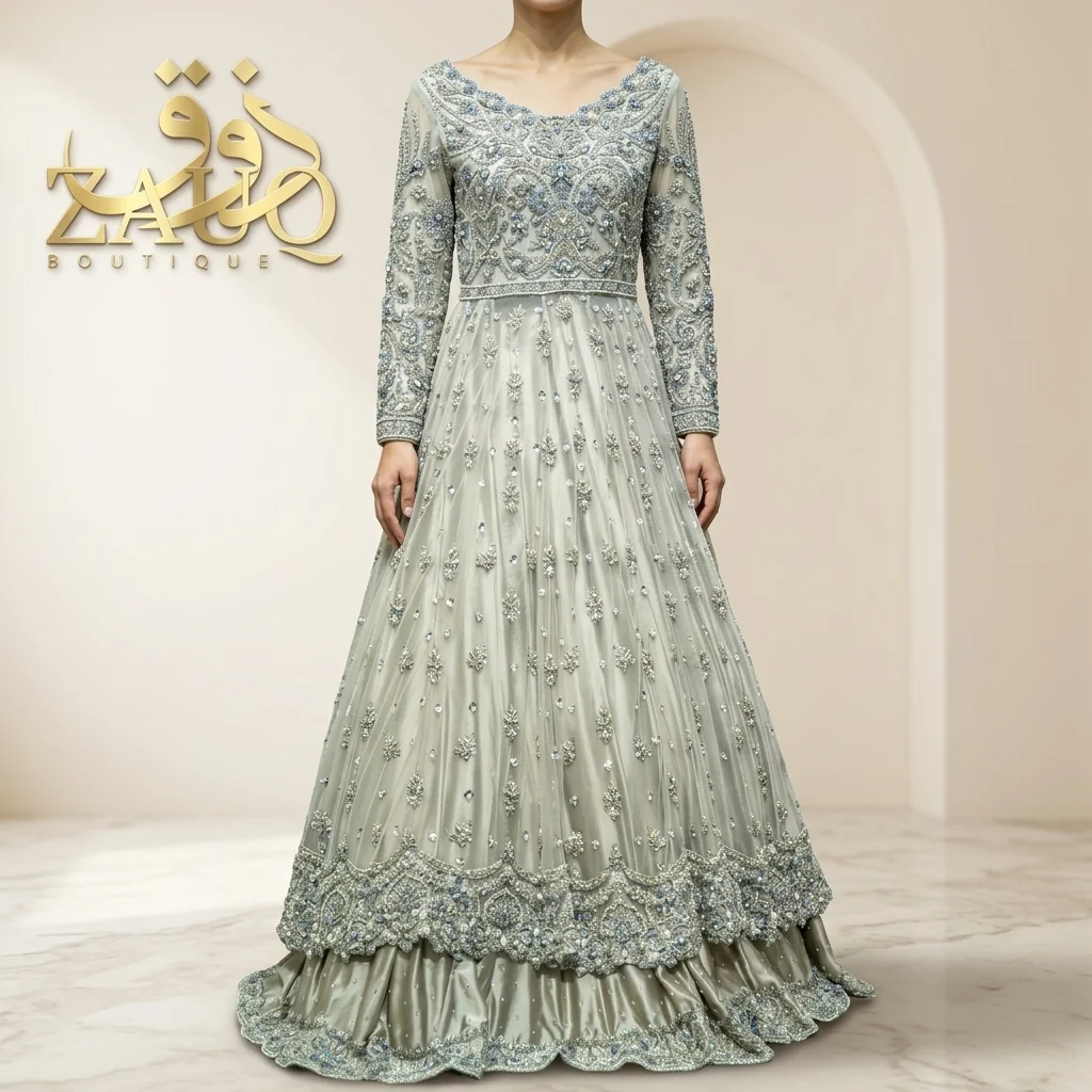 A soft silver-grey gown with fine net work, for the reception.